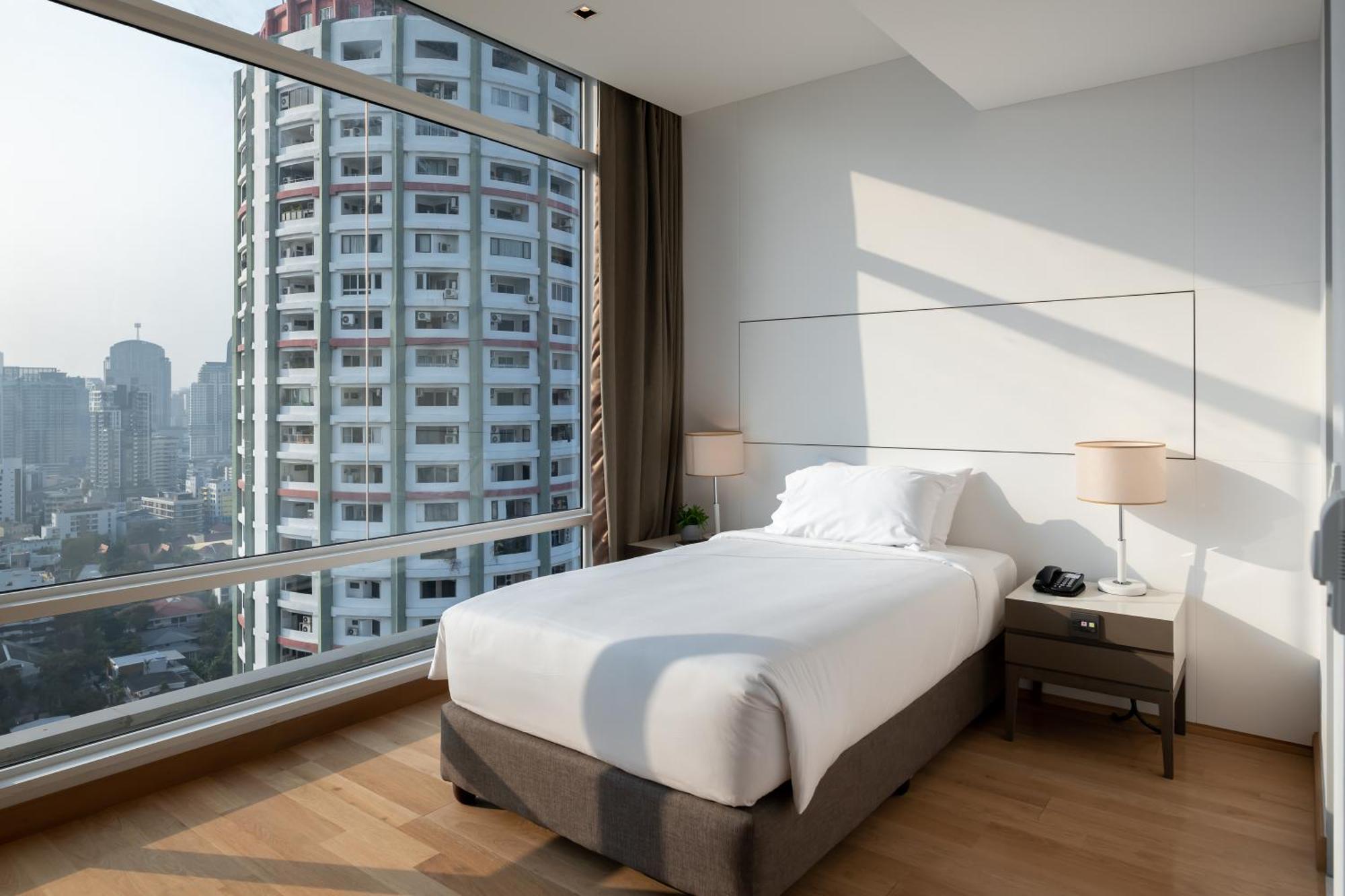 曼谷茉莉花59号酒店【SHA Plus+】 外观 照片 A bedroom at the hotel